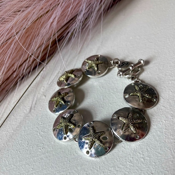 Silver sand dollar link bracelet. 7” includes clasp. - Picture 3 of 7